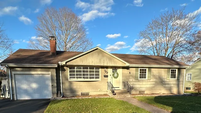 a front view of a house with yard