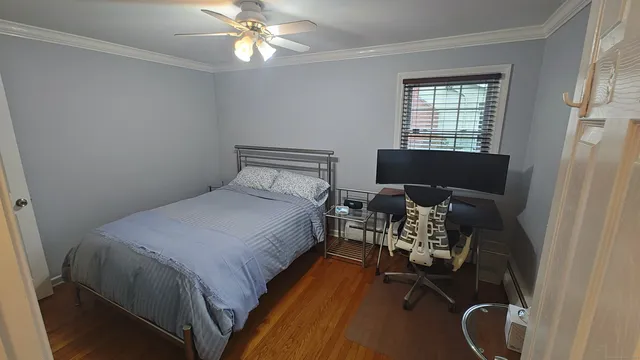 a bed room with a bed and a chandelier