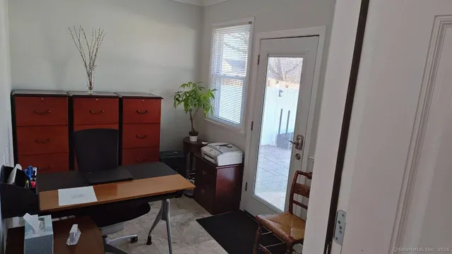 a living room with furniture and a window