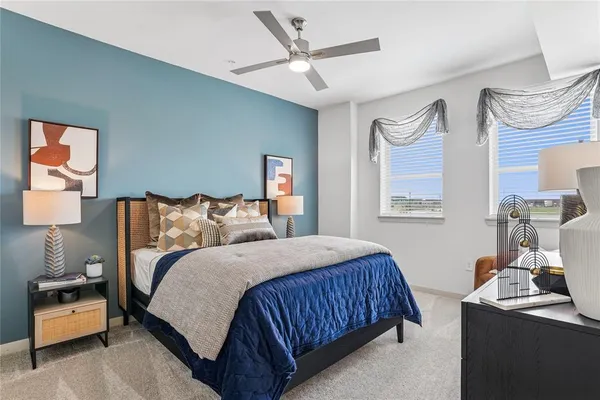 a bedroom with bed and window