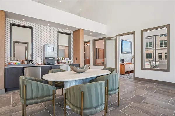 a dining room with furniture and window