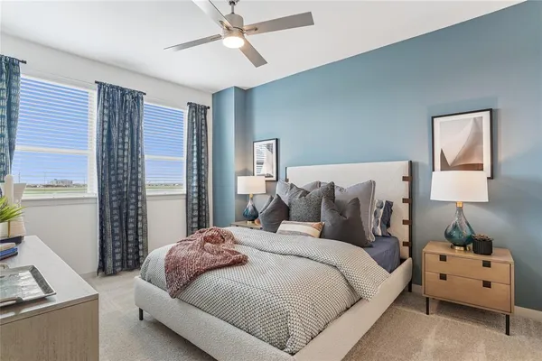 a bedroom with a bed and a couch