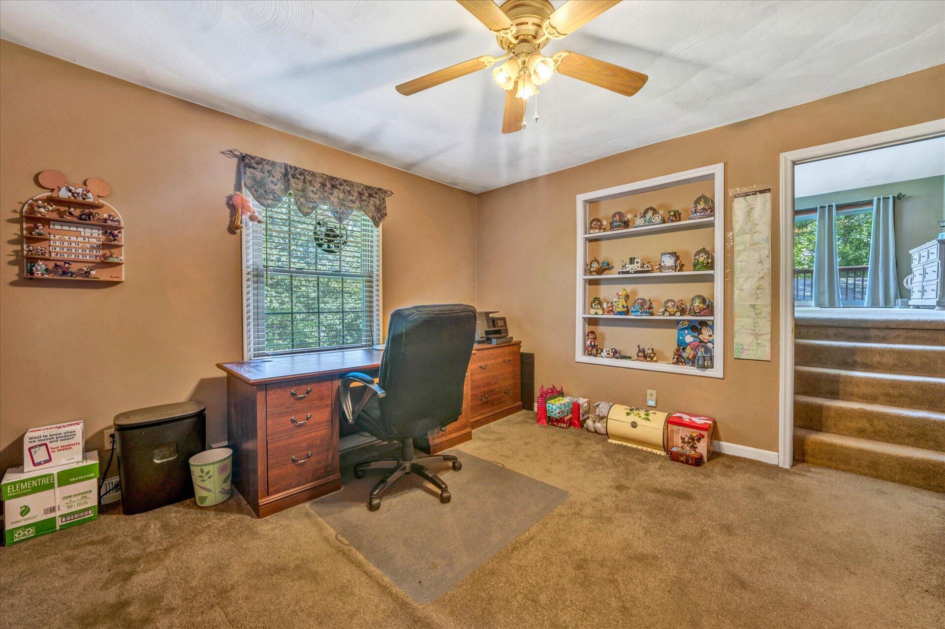 1182 Rabbit Drive Thaxton, VA 24174 - Photo 21 of 58 a view of a workspace with furniture and a window
