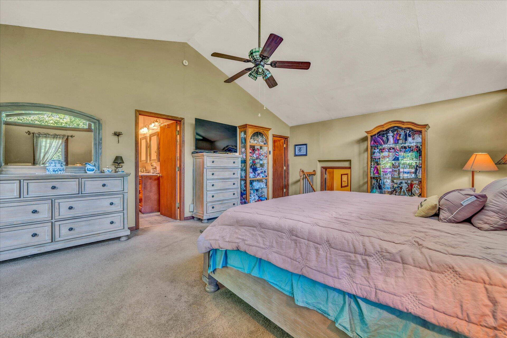 1182 Rabbit Drive Thaxton, VA 24174 - Photo 23 of 58 a bedroom with a bed and a chandelier