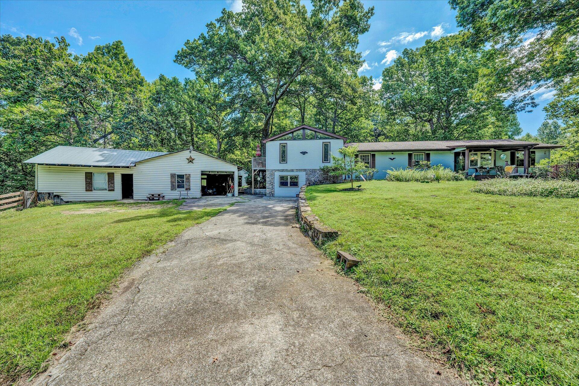 1182 Rabbit Drive Thaxton, VA 24174 - Photo 3 of 58 a front view of a house with yard and green space