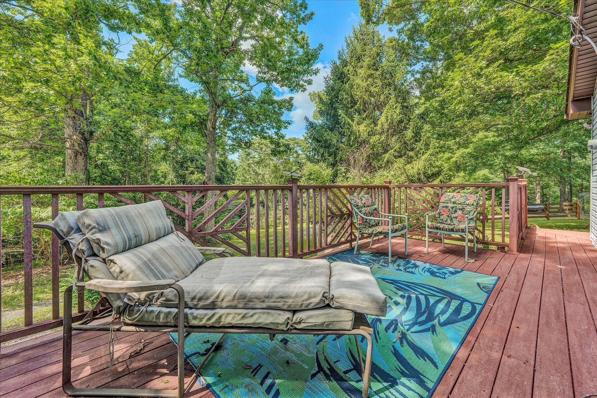 1182 Rabbit Drive Thaxton, VA 24174 - Photo 41 of 58 a balcony with wooden floor table and chairs