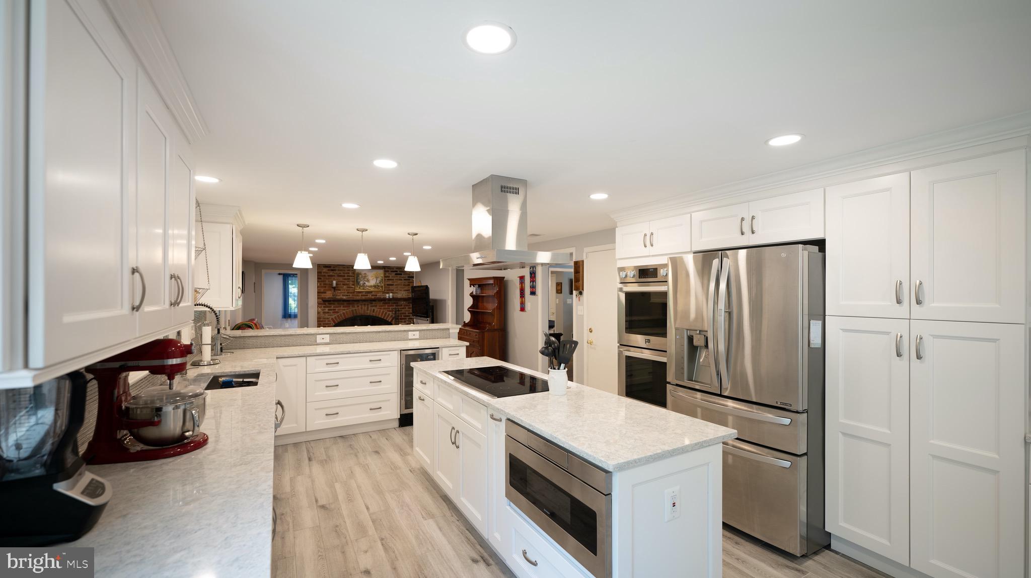 8924 Wooden Bridge Road Potomac, MD 20854 - Photo 11 of 53 Large center island with built-in microwave