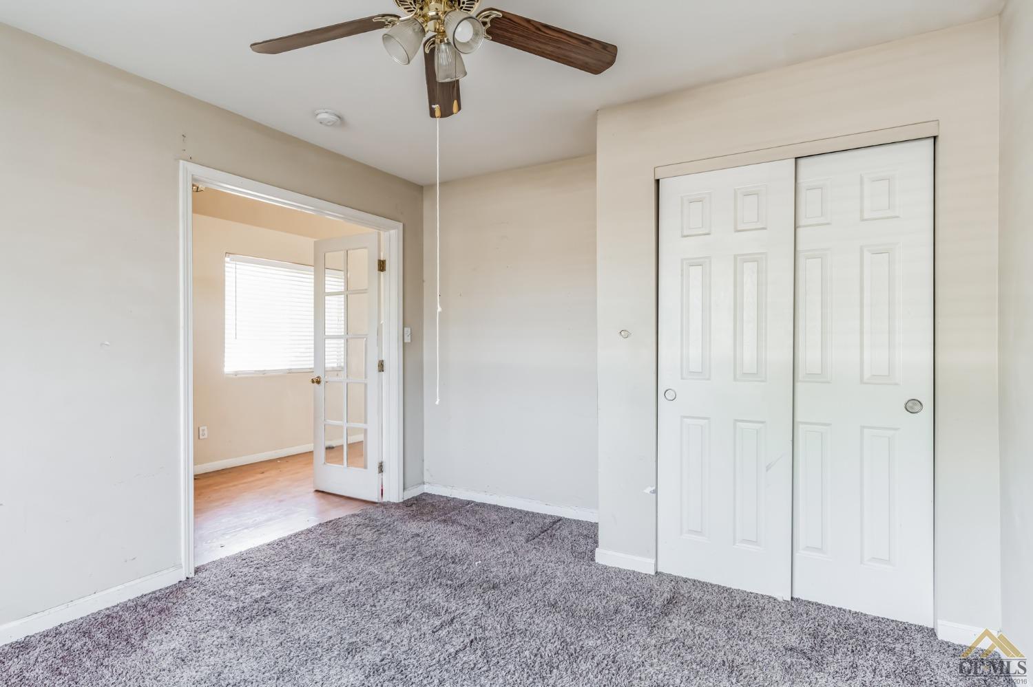 Undisclosed Address Bakersfield, CA 93307 - Photo 3 of 6 wooden floor in an empty room