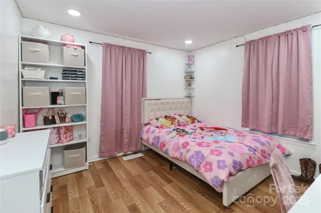 a bedroom with a bed and a closet
