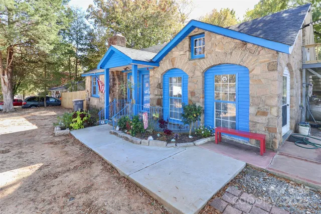 a view of front of house with large windows