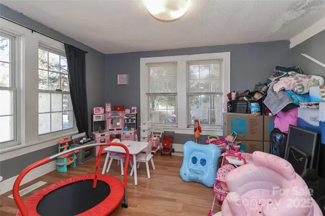 a bed room with furniture and a window