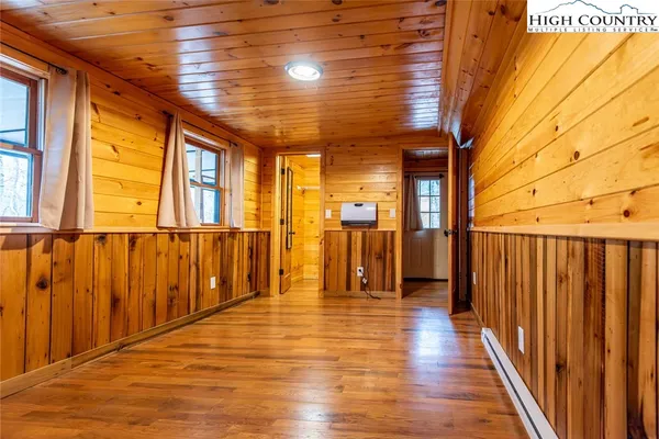 a view of a porch with wooden floor
