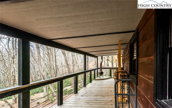 a view of hallway with wooden floor