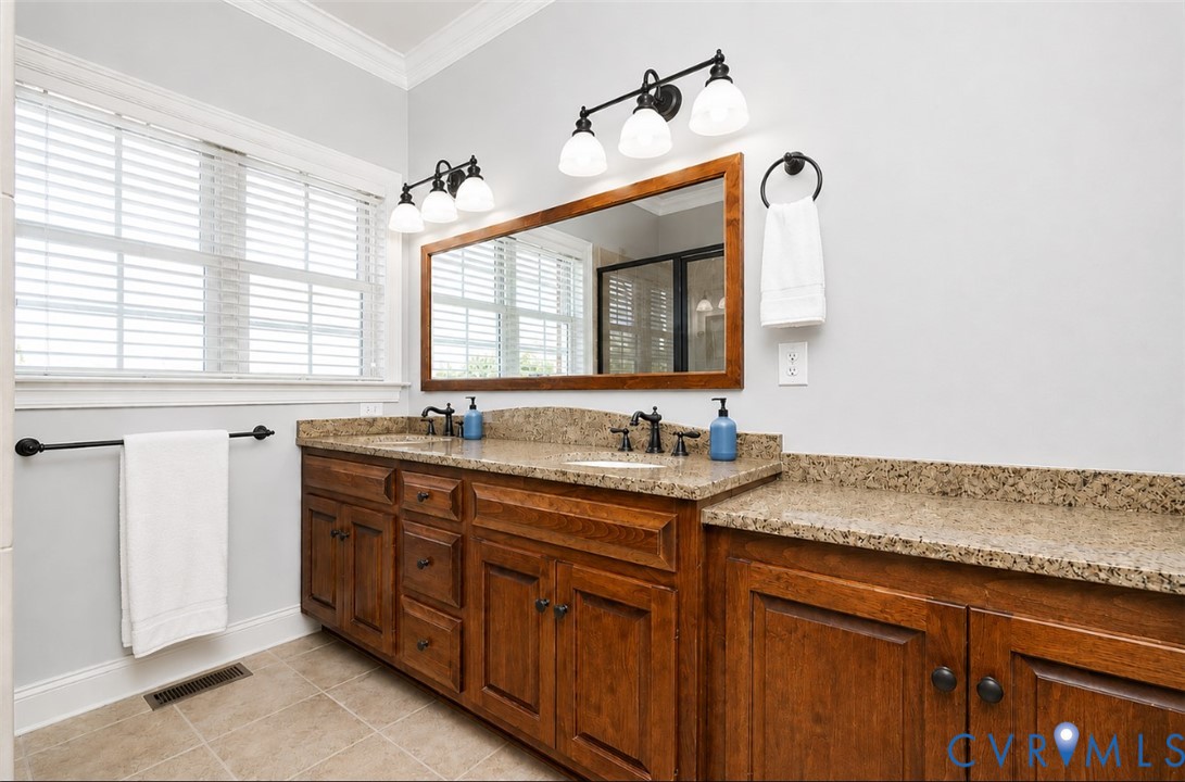 239 Jennings Road Cartersville, VA 23027 - Photo 20 of 26 Double vanity with granite countertops and wood ca