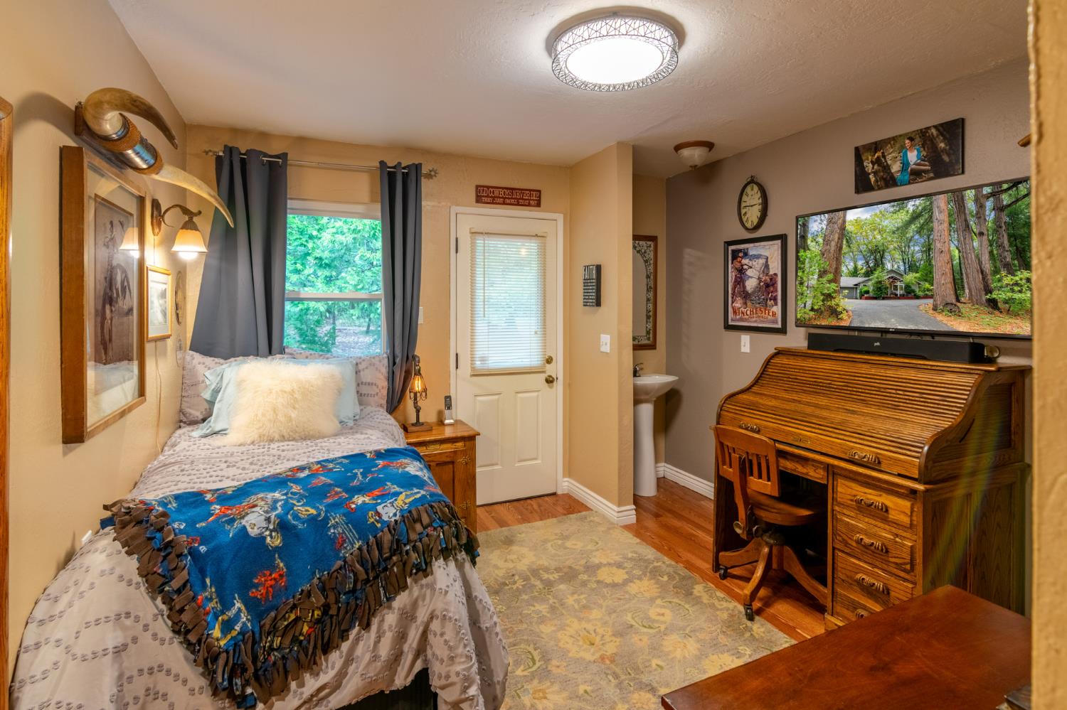 25681 Foresthill Road Foresthill, CA 95631 - Photo 13 of 29 a bedroom with a bed and wooden floor