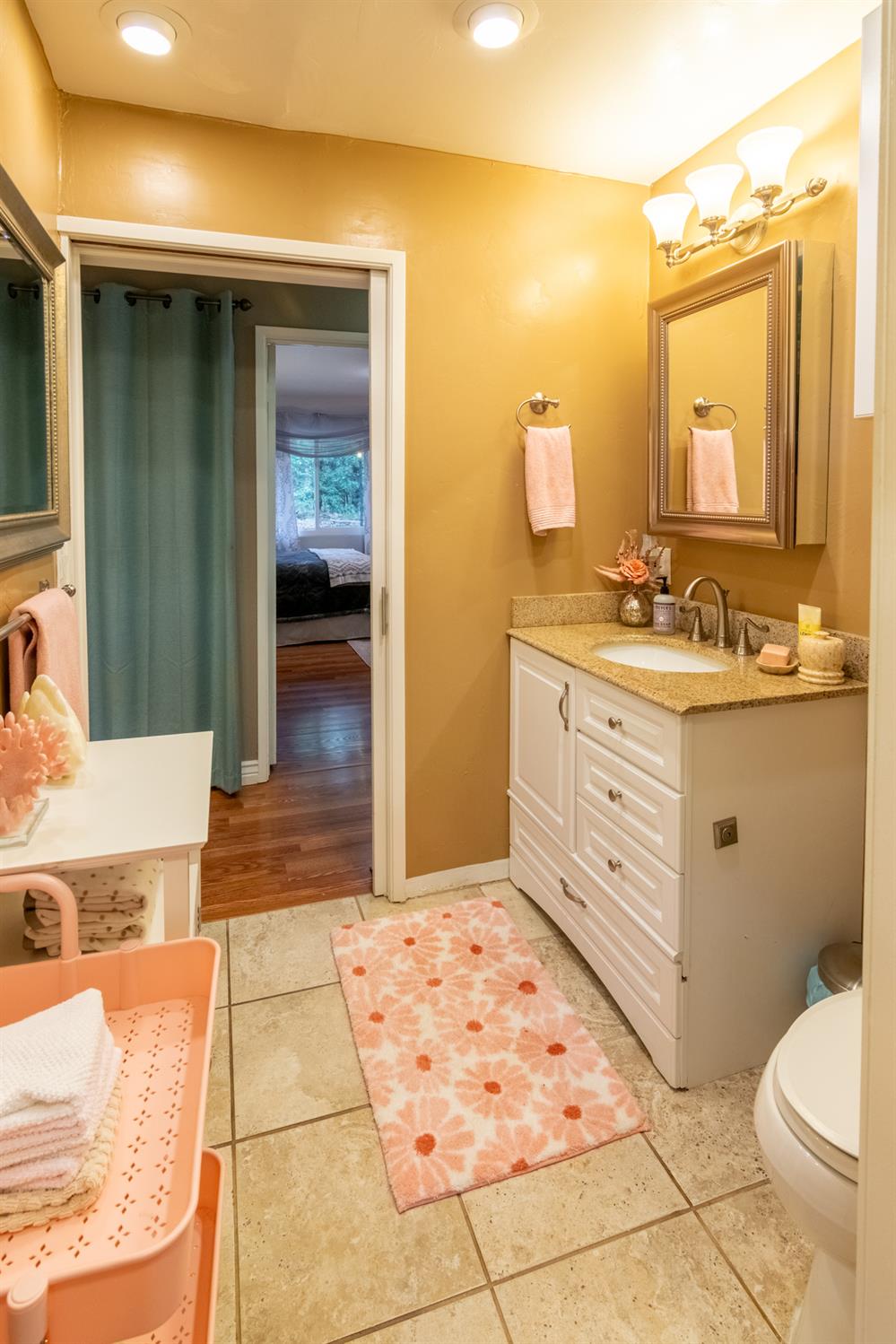 25681 Foresthill Road Foresthill, CA 95631 - Photo 14 of 29 a bathroom with a sink a toilet and mirror