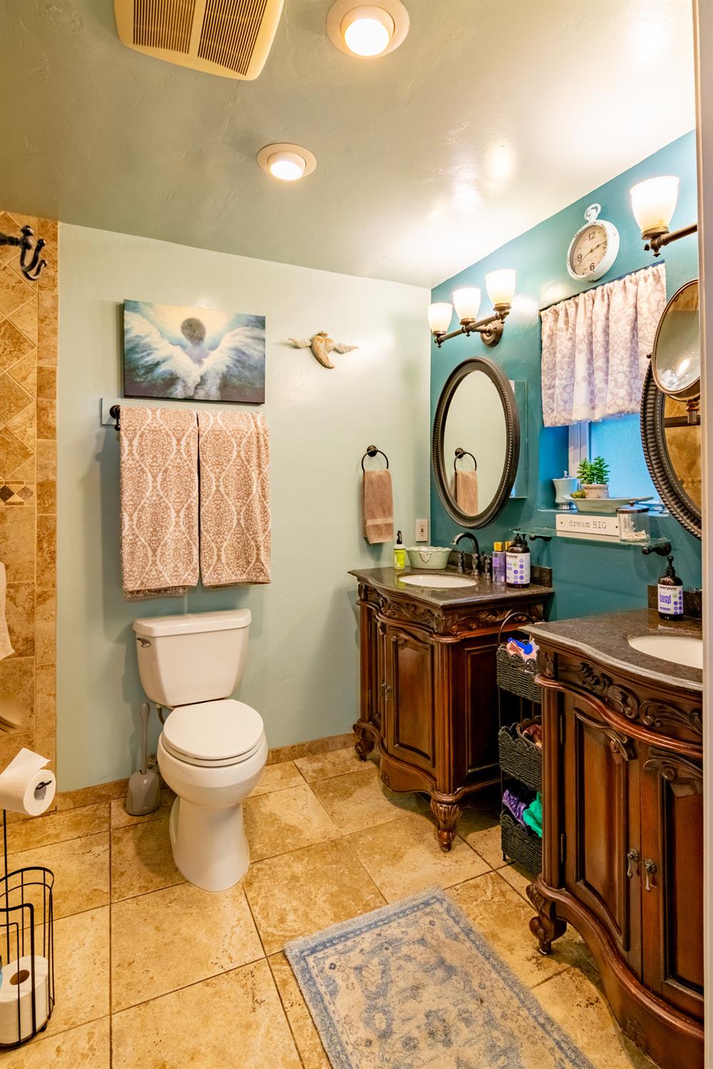 25681 Foresthill Road Foresthill, CA 95631 - Photo 18 of 29 a bathroom with a toilet a sink and a mirror