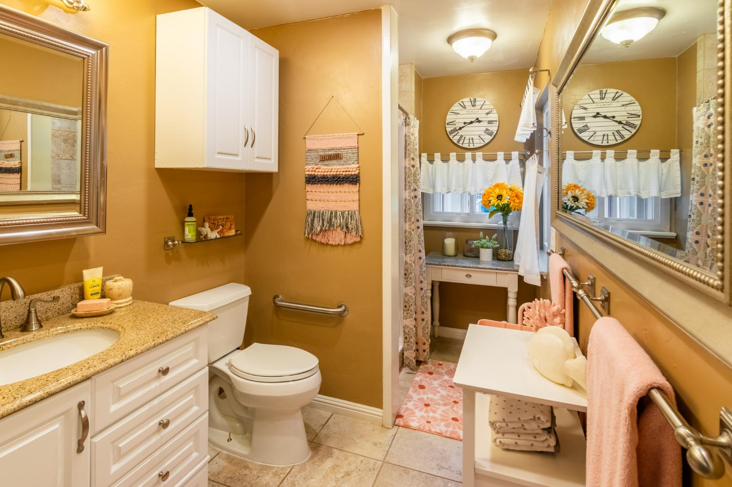 25681 Foresthill Road Foresthill, CA 95631 - Photo 20 of 29 a bathroom with a granite countertop sink mirror vanity and toilet