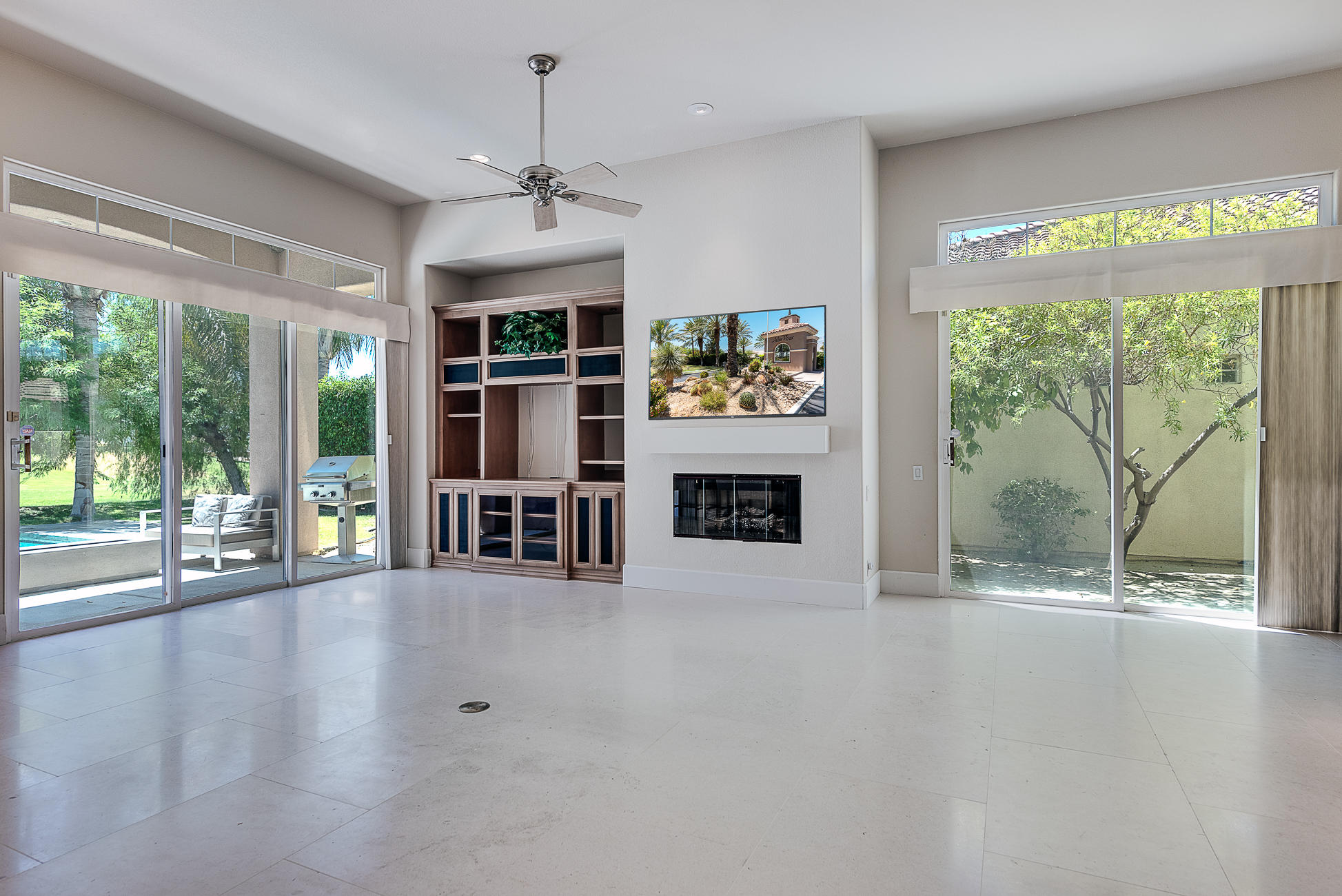20 Vía Bella Rancho Mirage, CA 92270 - Photo 12 of 26 a view of an empty room with a fireplace and a large window