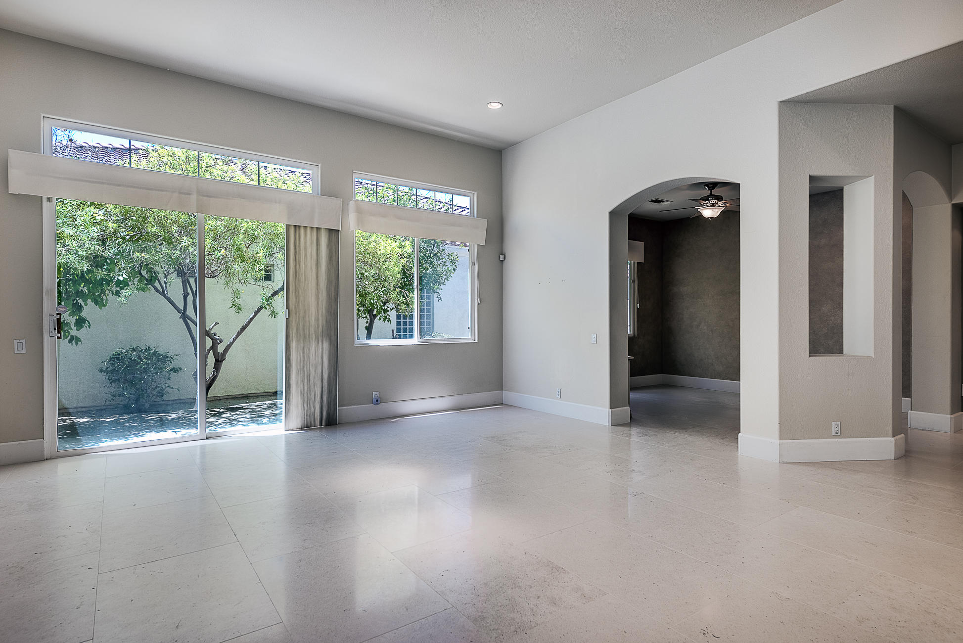 20 Vía Bella Rancho Mirage, CA 92270 - Photo 13 of 26 an empty room with large windows and view of outdoor space