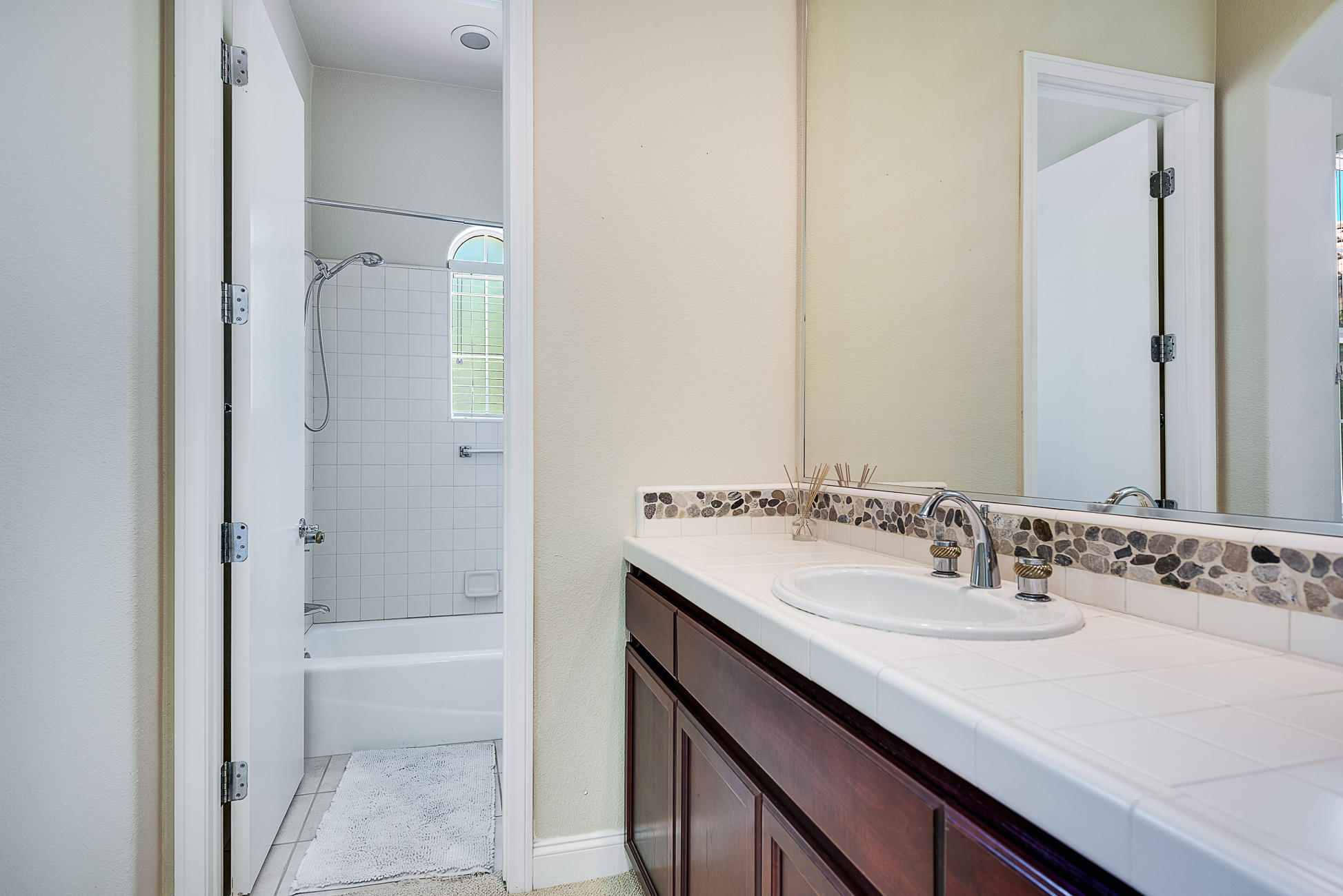 20 Vía Bella Rancho Mirage, CA 92270 - Photo 23 of 26 a bathroom with a sink and a mirror