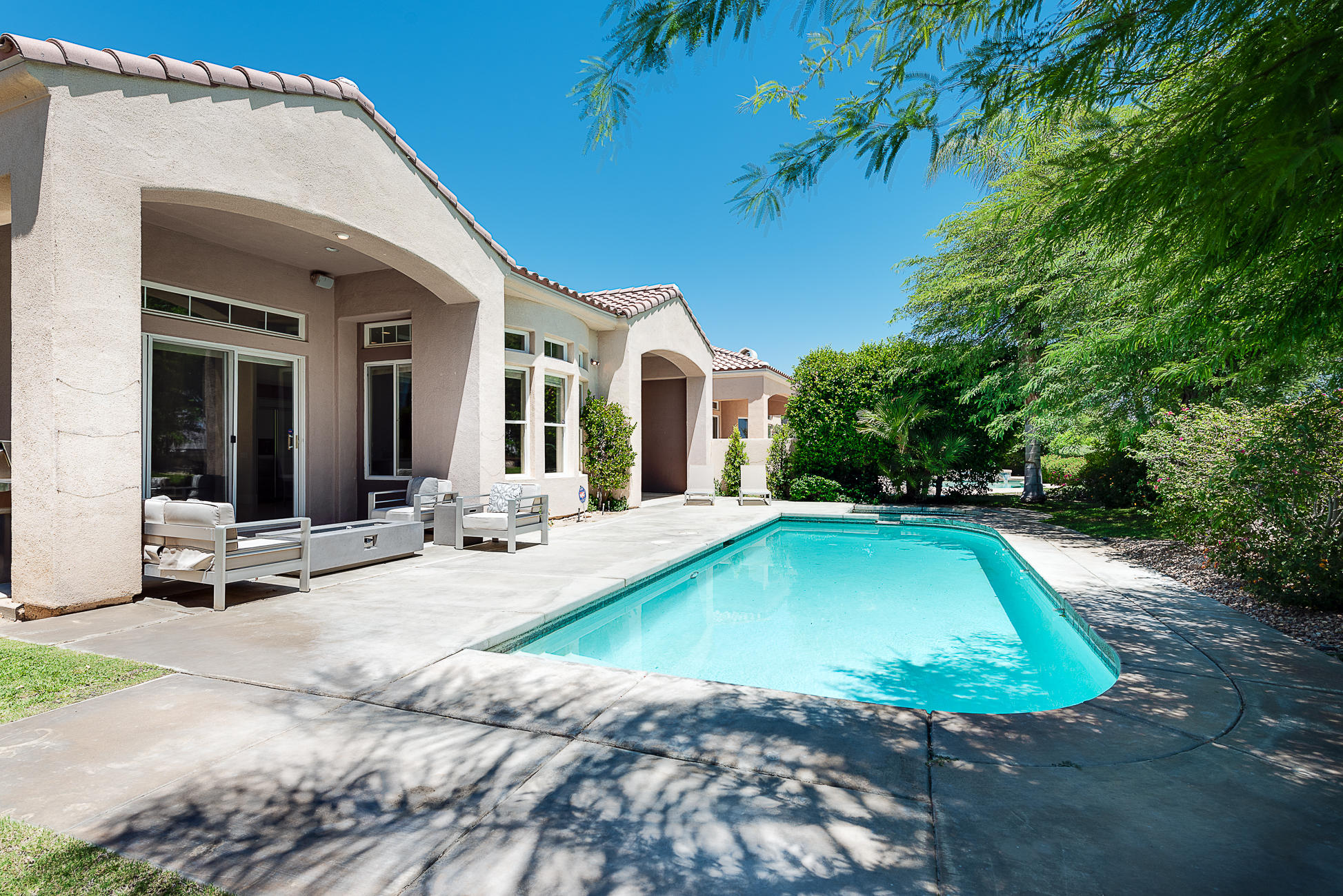 20 Vía Bella Rancho Mirage, CA 92270 - Photo 24 of 26 a view of a house with backyard patio and swimming pool