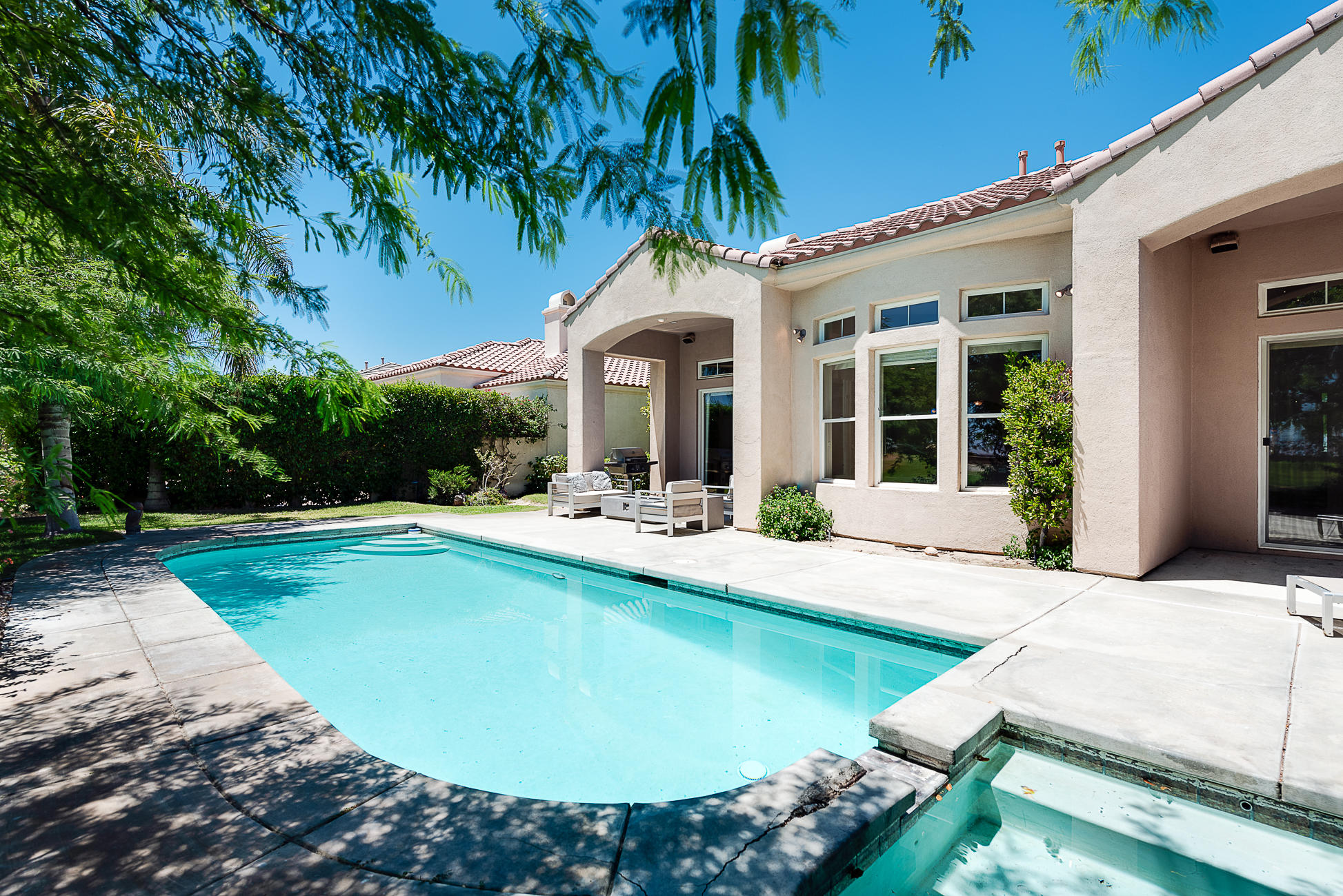 20 Vía Bella Rancho Mirage, CA 92270 - Photo 25 of 26 a view of a house with swimming pool and porch with furniture