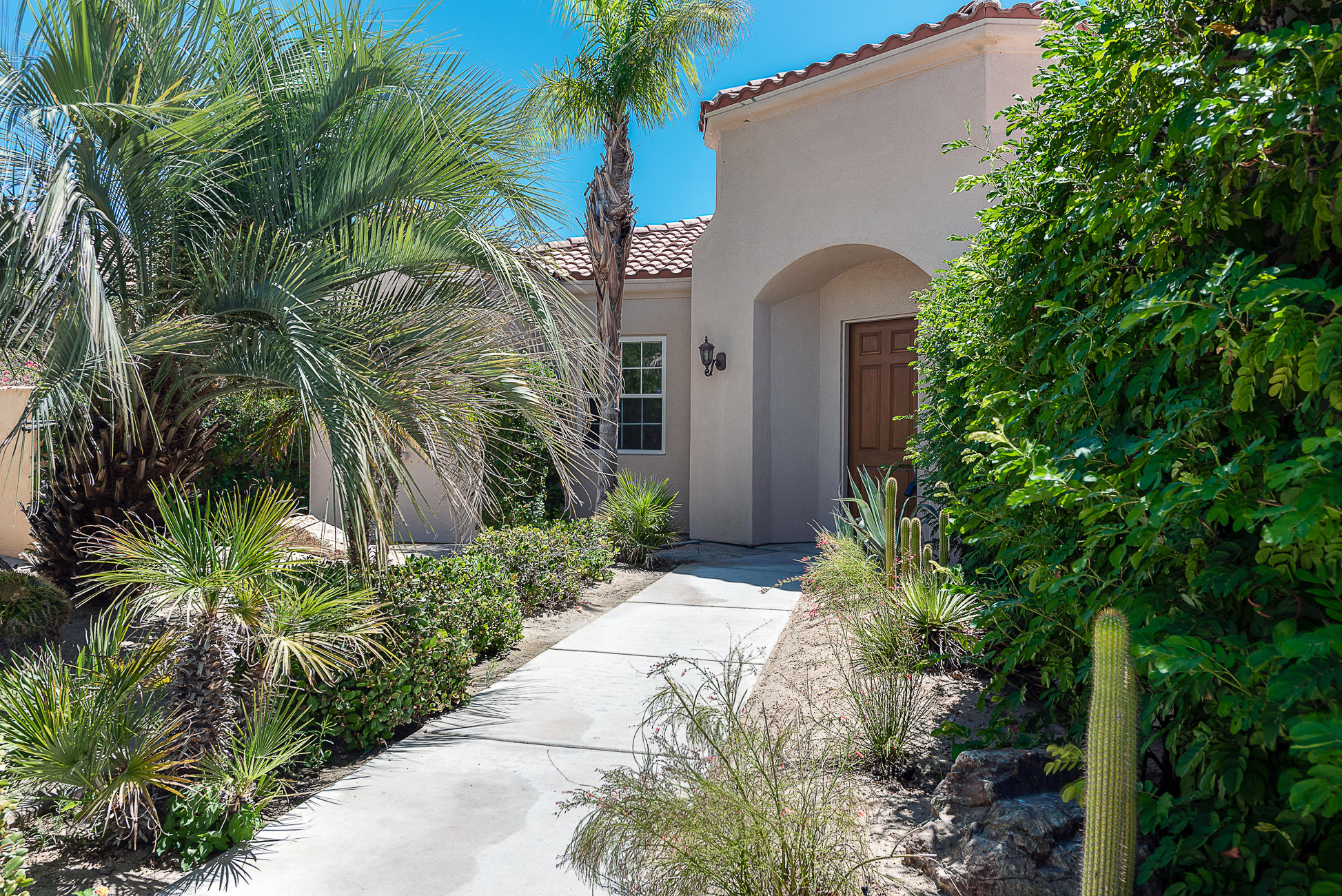 20 Vía Bella Rancho Mirage, CA 92270 - Photo 6 of 26 a couple of potted plants in front of door
