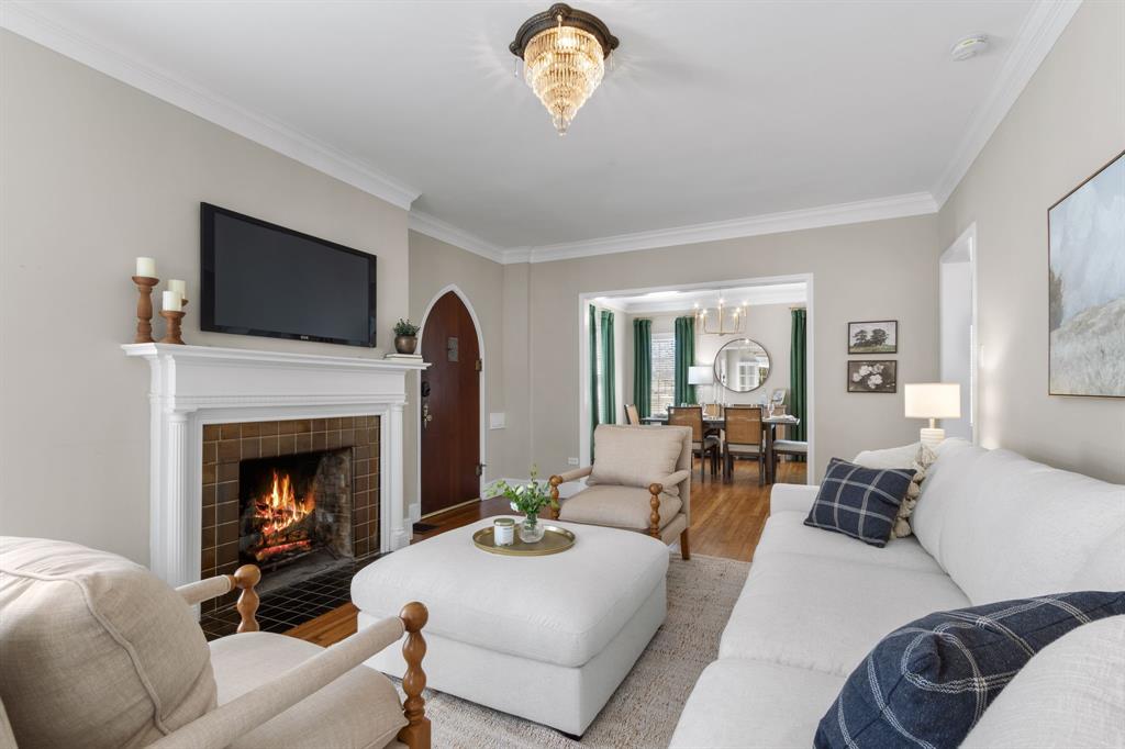 2815 Cumberland Avenue Waco, TX 76708 - Photo 6 of 40 a living room with furniture a fireplace and a flat screen tv