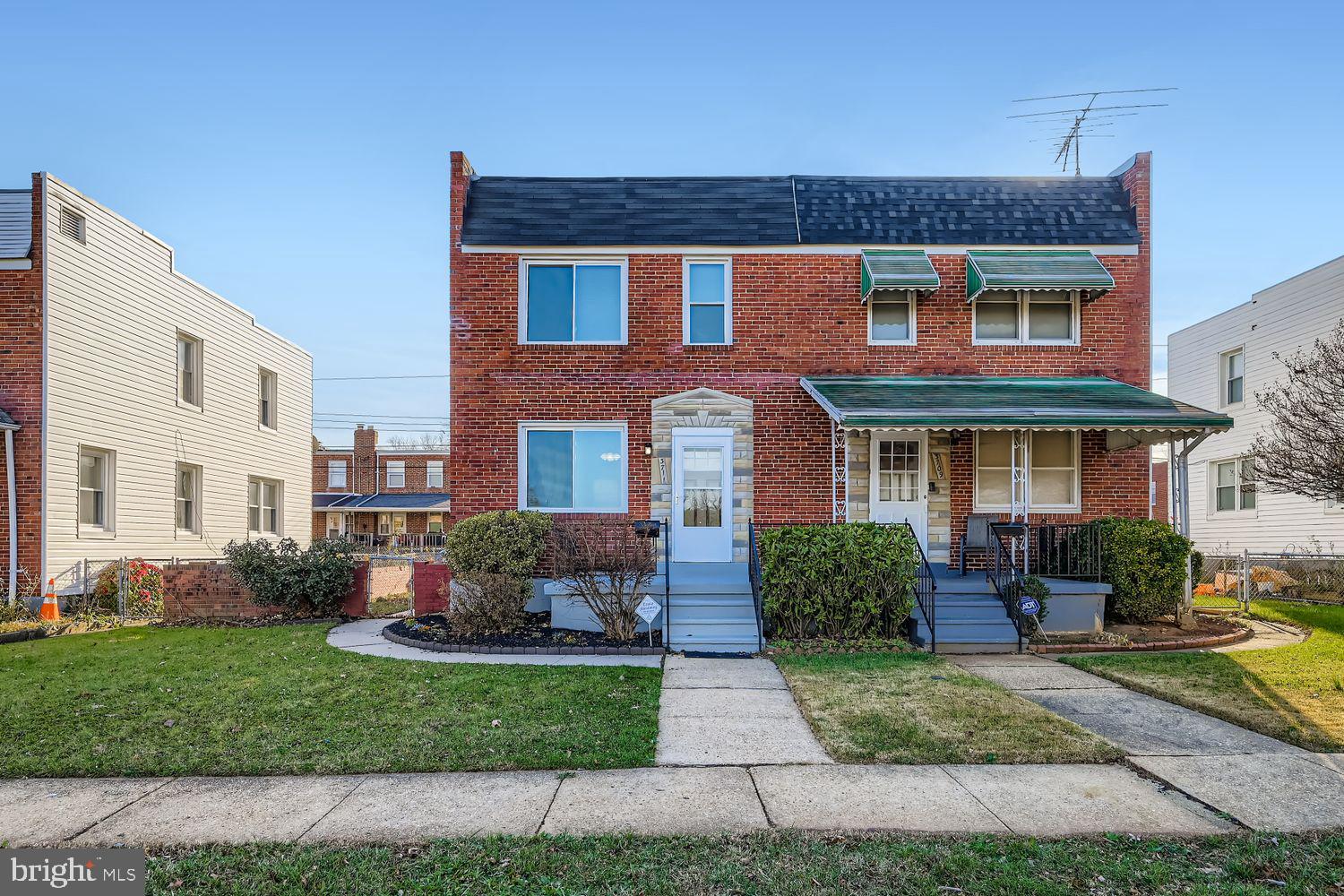 3711 Ina Avenue Baltimore, MD 21206 - Photo 1 of 29 a front view of a house with a yard