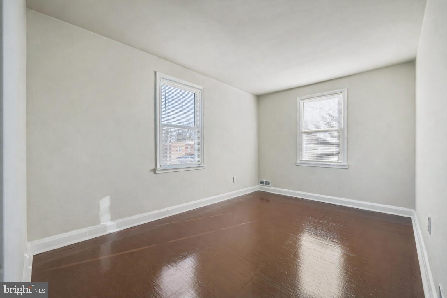 3711 Ina Avenue Baltimore, MD 21206 - Photo 19 of 29 a view of a room with wooden floor and window