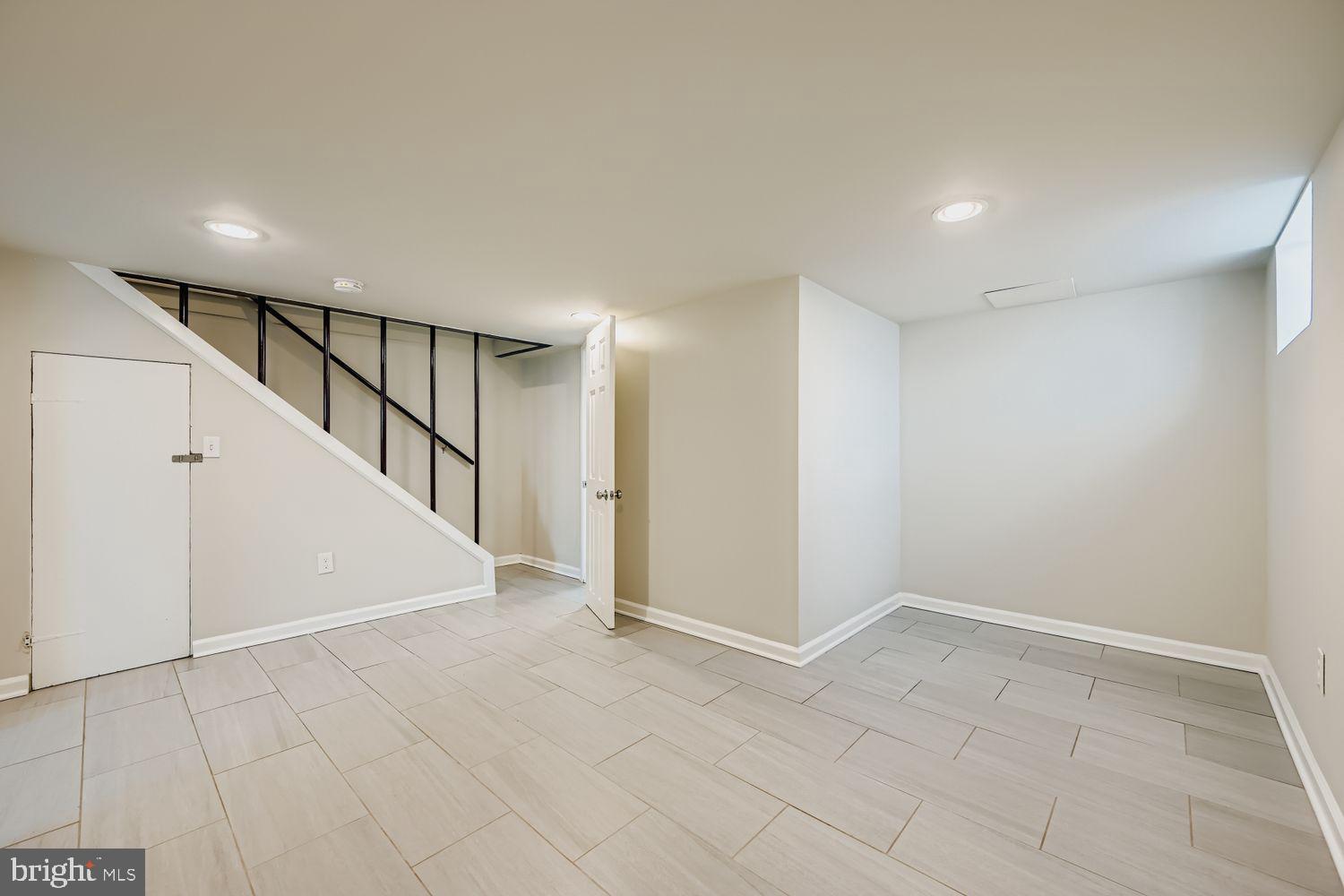 3711 Ina Avenue Baltimore, MD 21206 - Photo 20 of 29 a view of an empty room with stairs