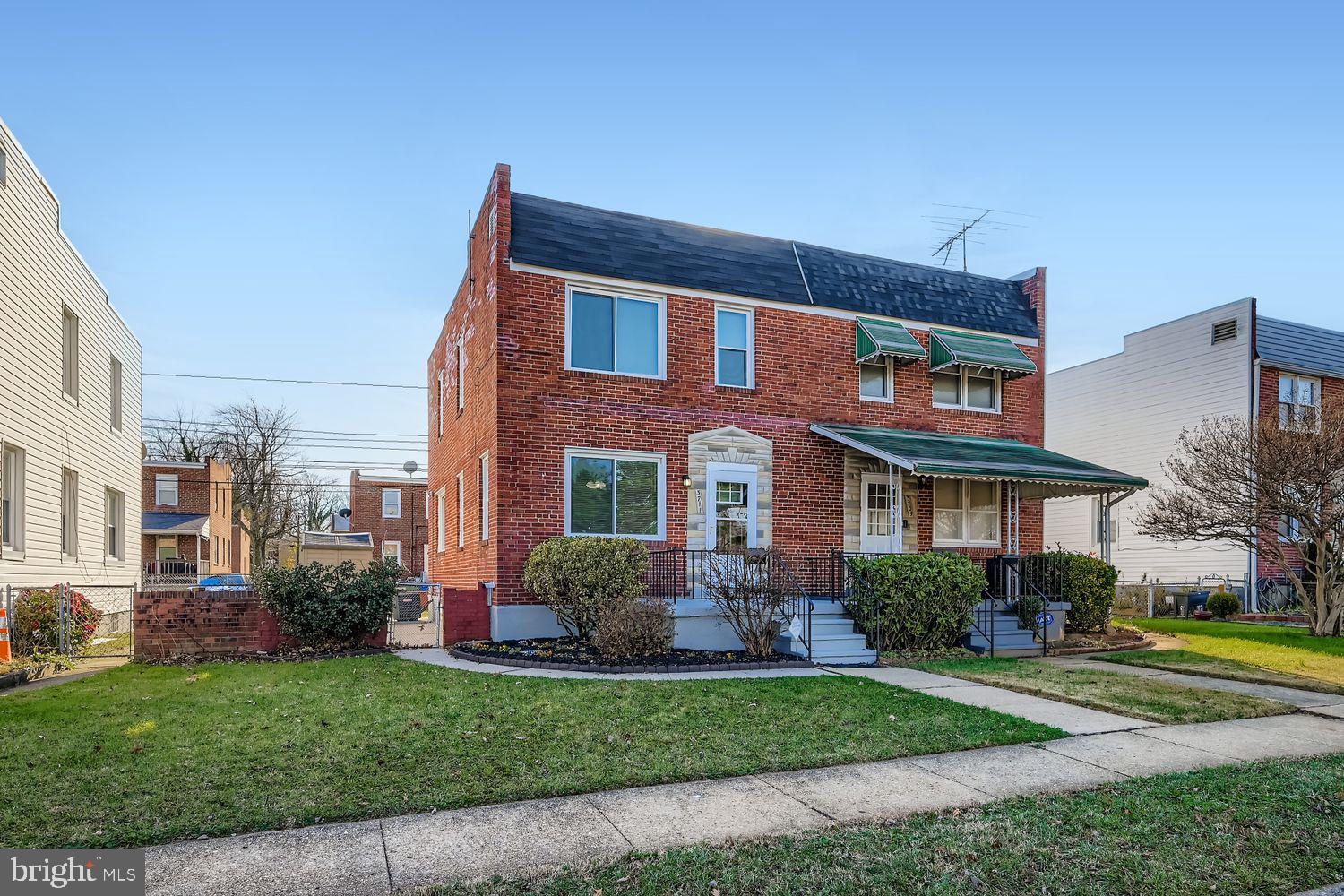 3711 Ina Avenue Baltimore, MD 21206 - Photo 2 of 29 a front view of a house with garden