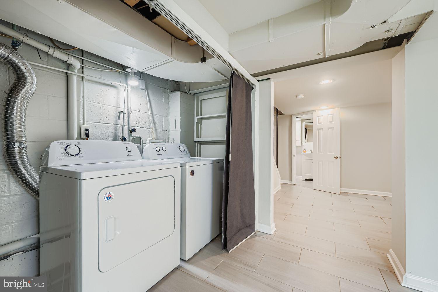 3711 Ina Avenue Baltimore, MD 21206 - Photo 25 of 29 a utility room with dryer and washer