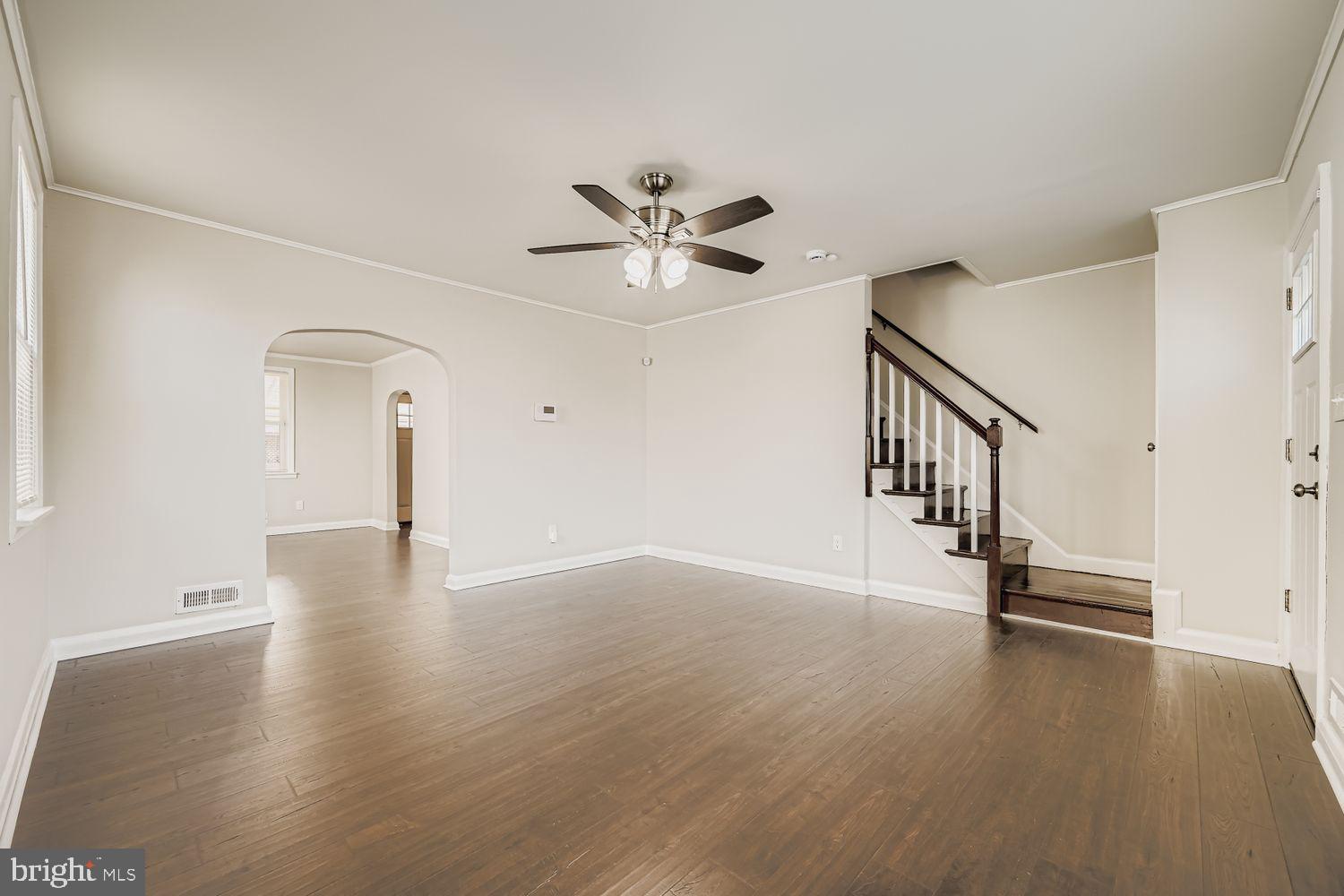 3711 Ina Avenue Baltimore, MD 21206 - Photo 7 of 29 wooden floor in an empty room with a window