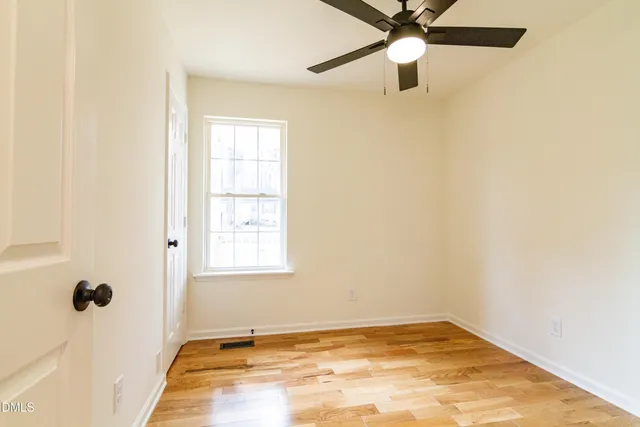 a kitchen with a sink appliances and cabinets