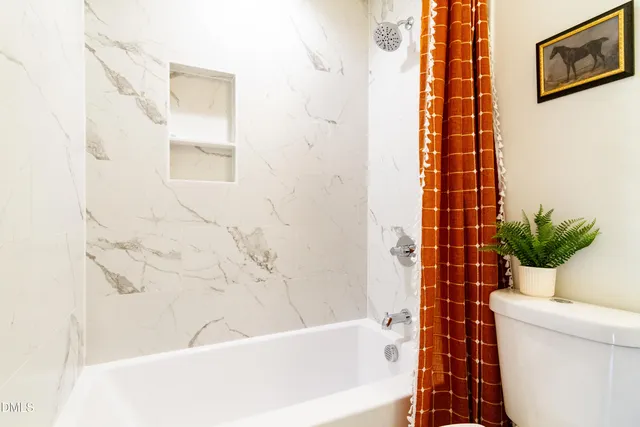 a bathroom with a sink a toilet and a tub