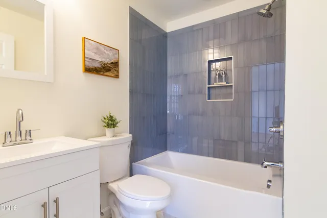 a bedroom with a bed and a ceiling fan