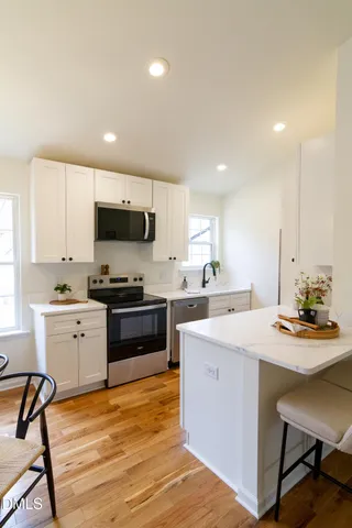 a living room with furniture and a lamp