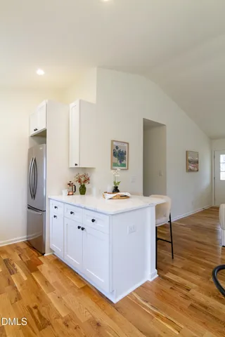 a view of a kitchen with workspace and a window