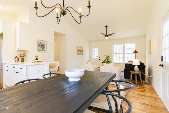a kitchen with a sink cabinets and wooden floor