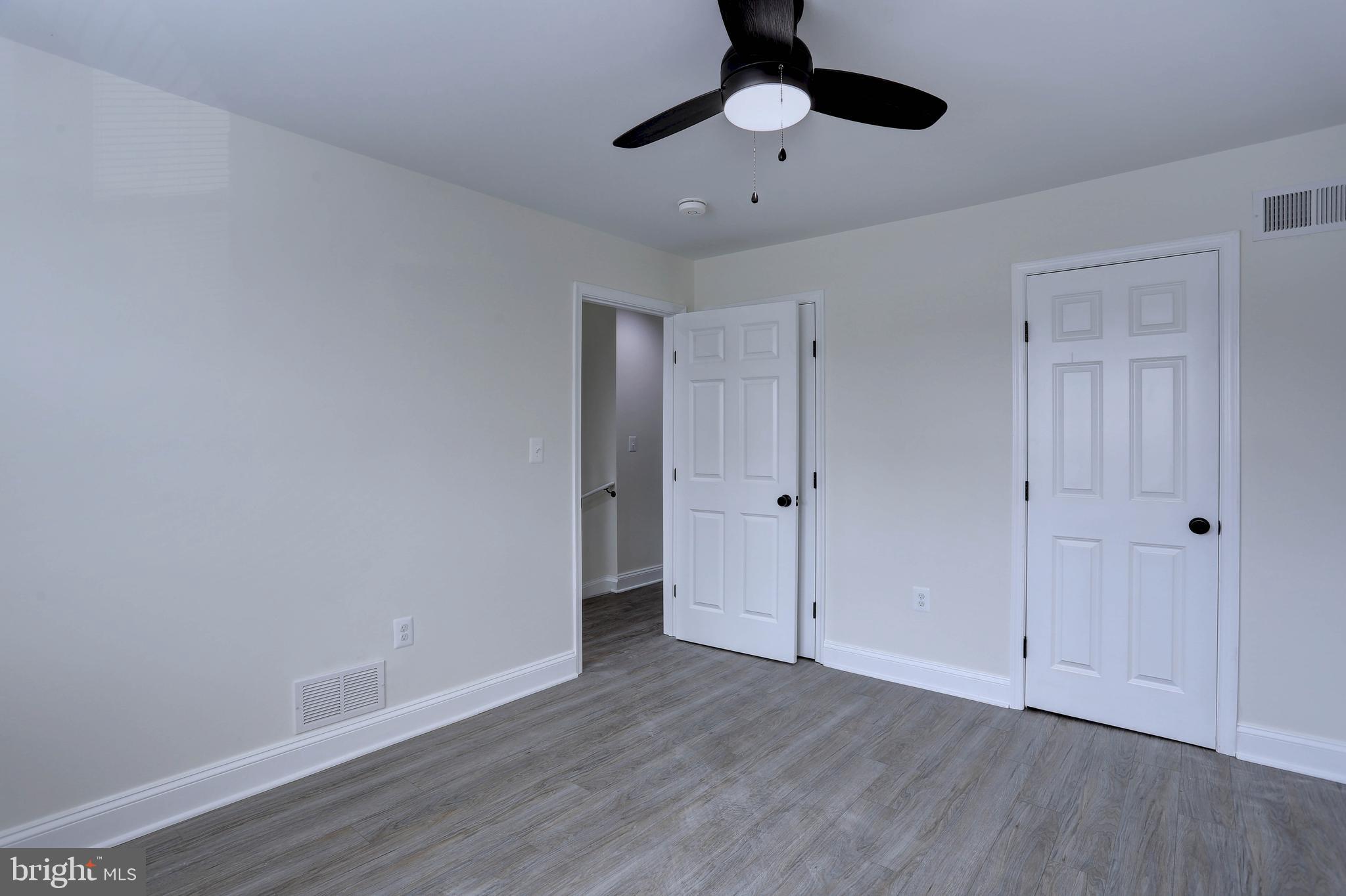 5564 Channing Road Baltimore, MD 21229 - Photo 15 of 32 a view of an empty room and wooden floor