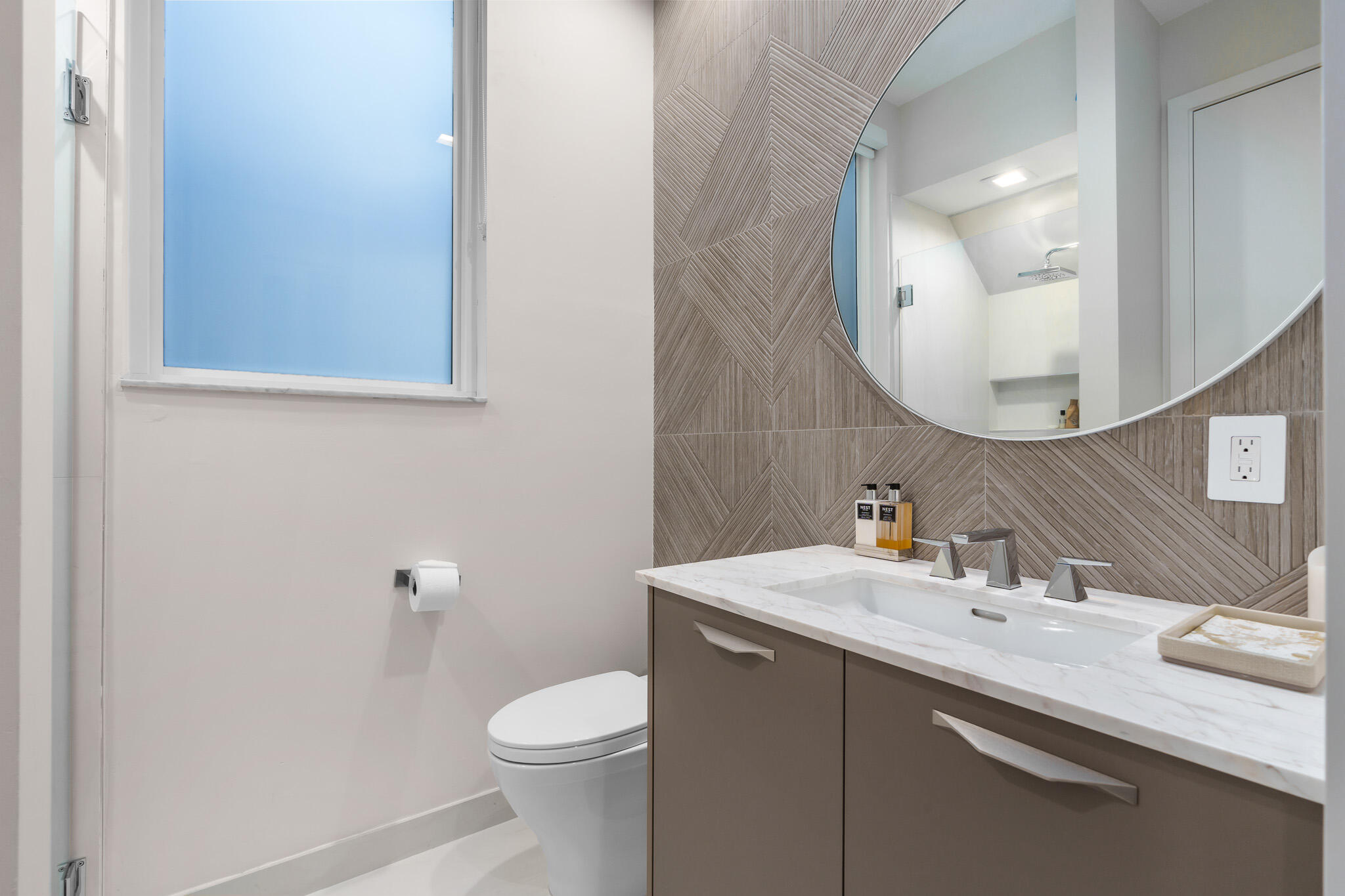 7952 Trieste Place Delray Beach, FL 33446 - Photo 24 of 59 a bathroom with a sink a toilet and a mirror