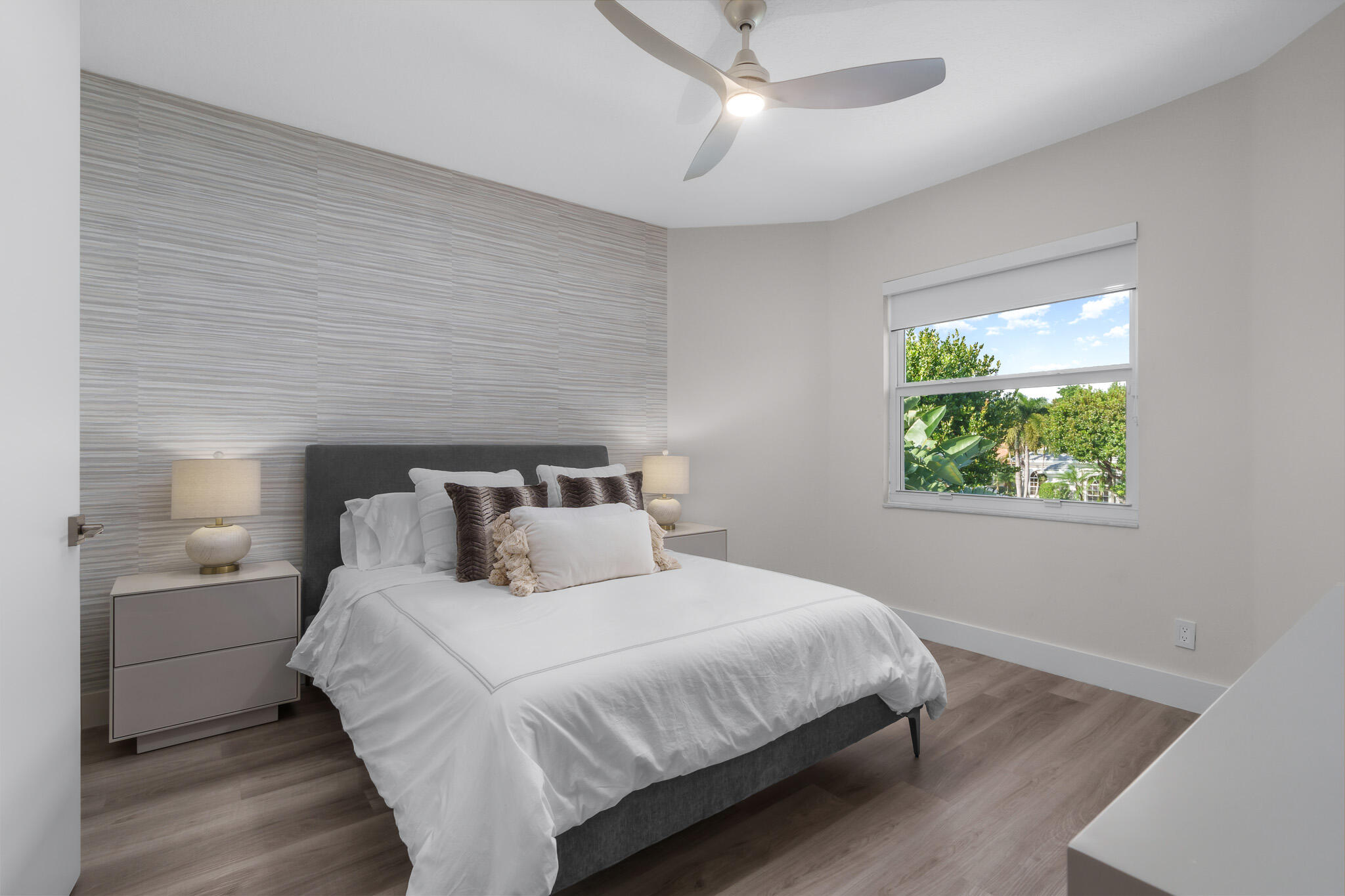 7952 Trieste Place Delray Beach, FL 33446 - Photo 30 of 59 a bedroom with a large bed and a window