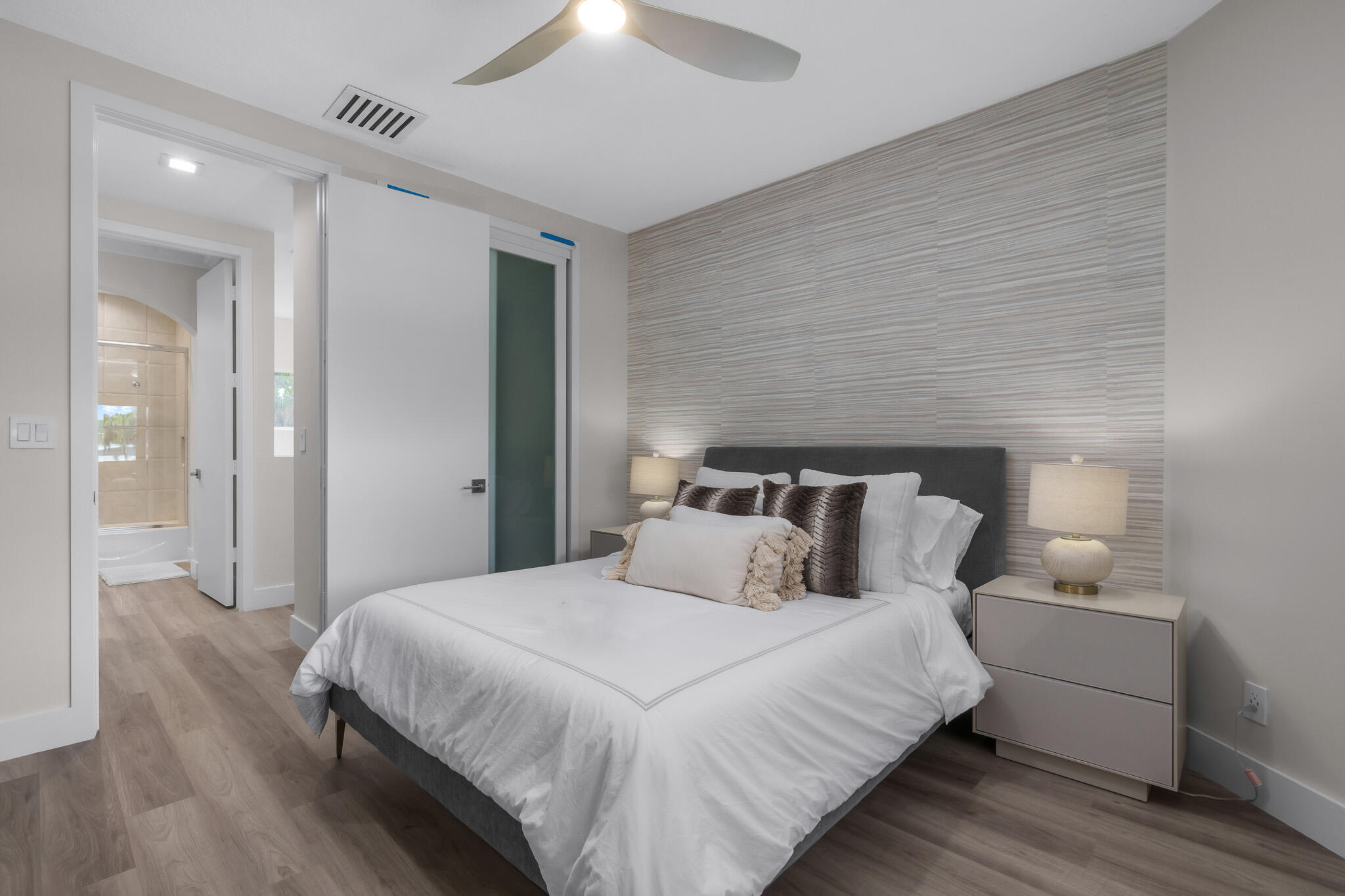 7952 Trieste Place Delray Beach, FL 33446 - Photo 31 of 59 a bedroom with bed and a night stand