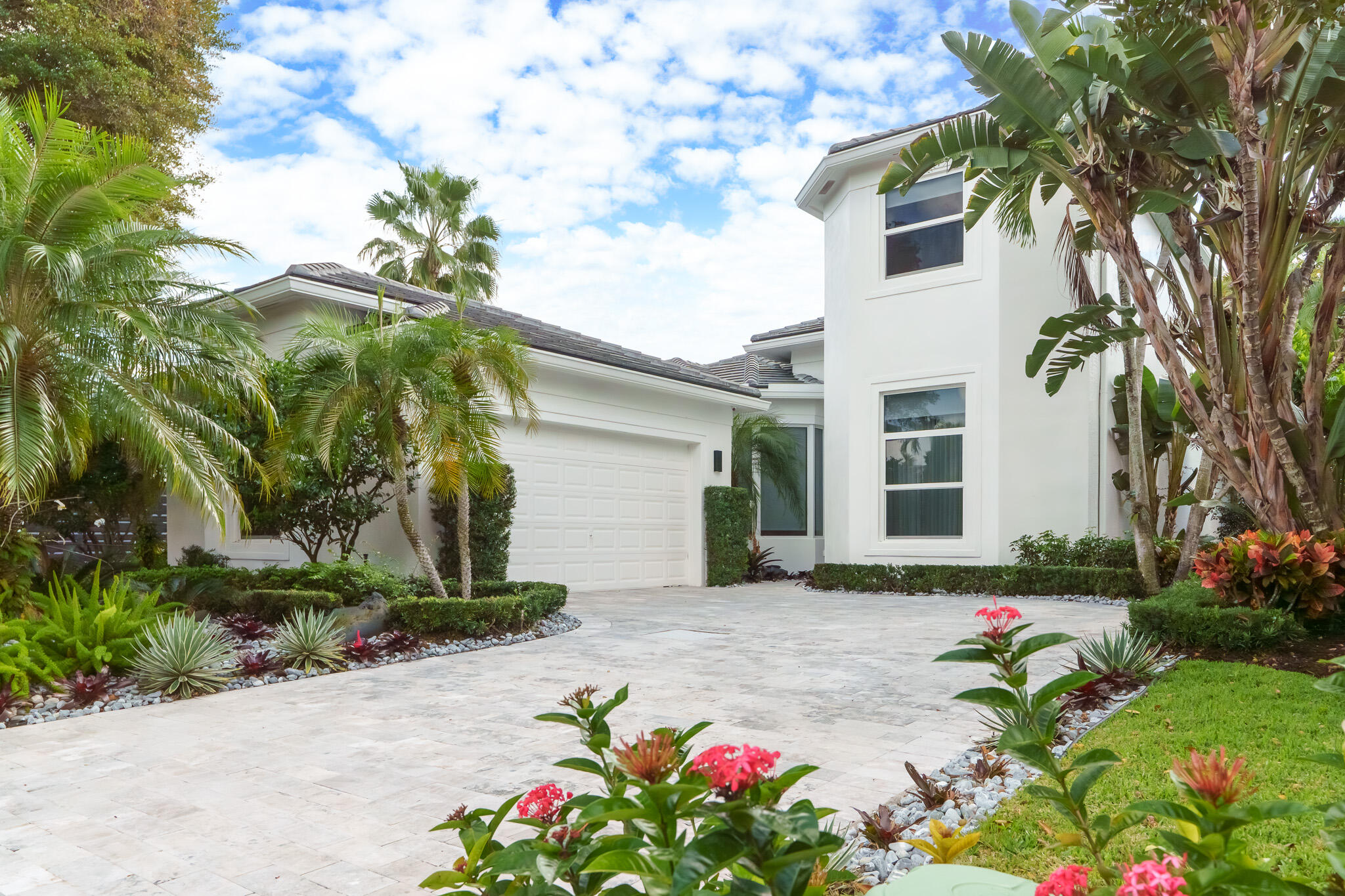 7952 Trieste Place Delray Beach, FL 33446 - Photo 35 of 59 a front view of a house with a yard and potted plants