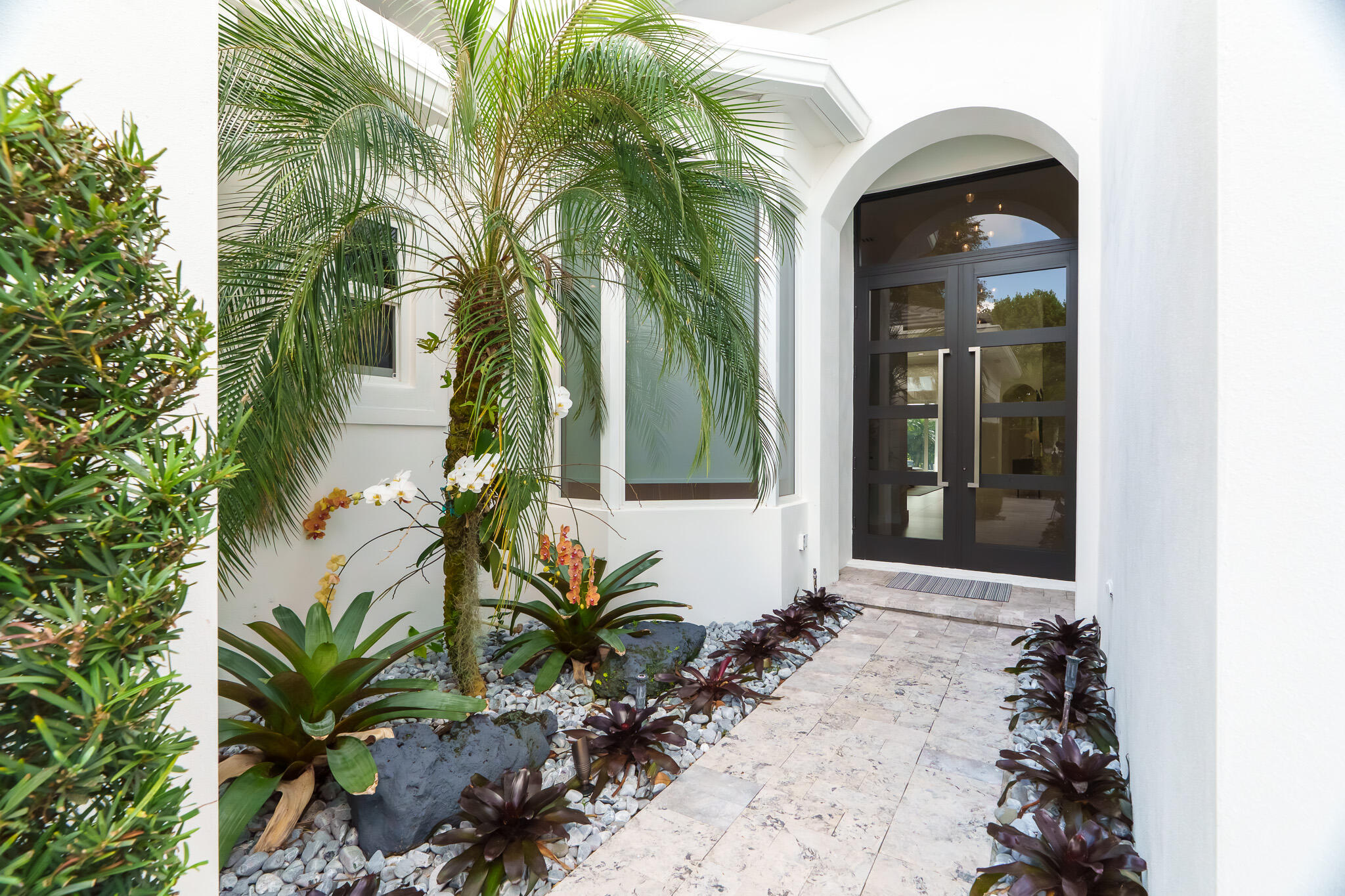 7952 Trieste Place Delray Beach, FL 33446 - Photo 36 of 59 a front view of a house with a yard