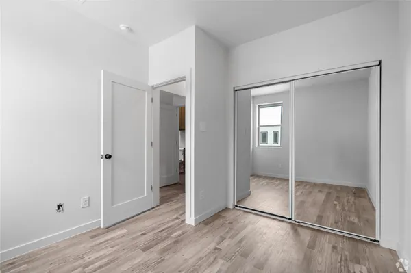 a view of entryway with wooden floor