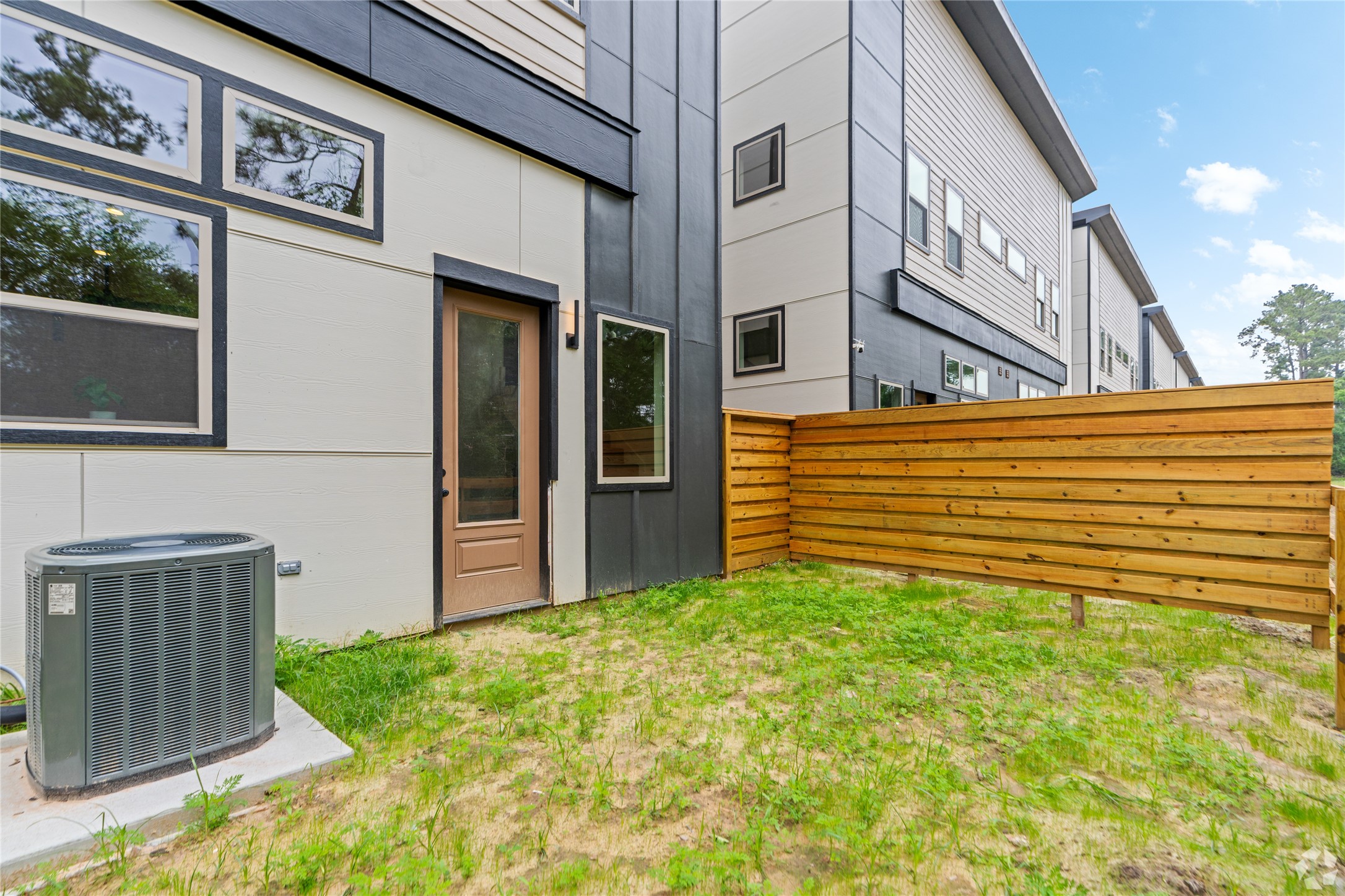 13106 Beauty Berry Ridge Lane Cypress, TX 77429 - Photo 16 of 24 a view of a house with many windows
