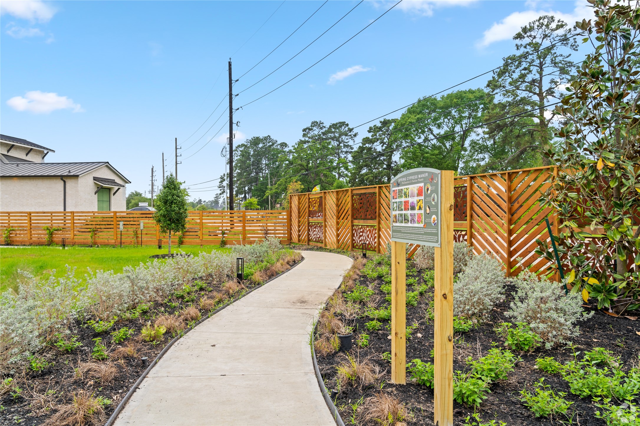 13106 Beauty Berry Ridge Lane Cypress, TX 77429 - Photo 22 of 24 a pathway of a house with a yard and sitting area